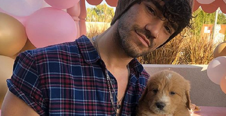 brett caprioni with puppy on instagram