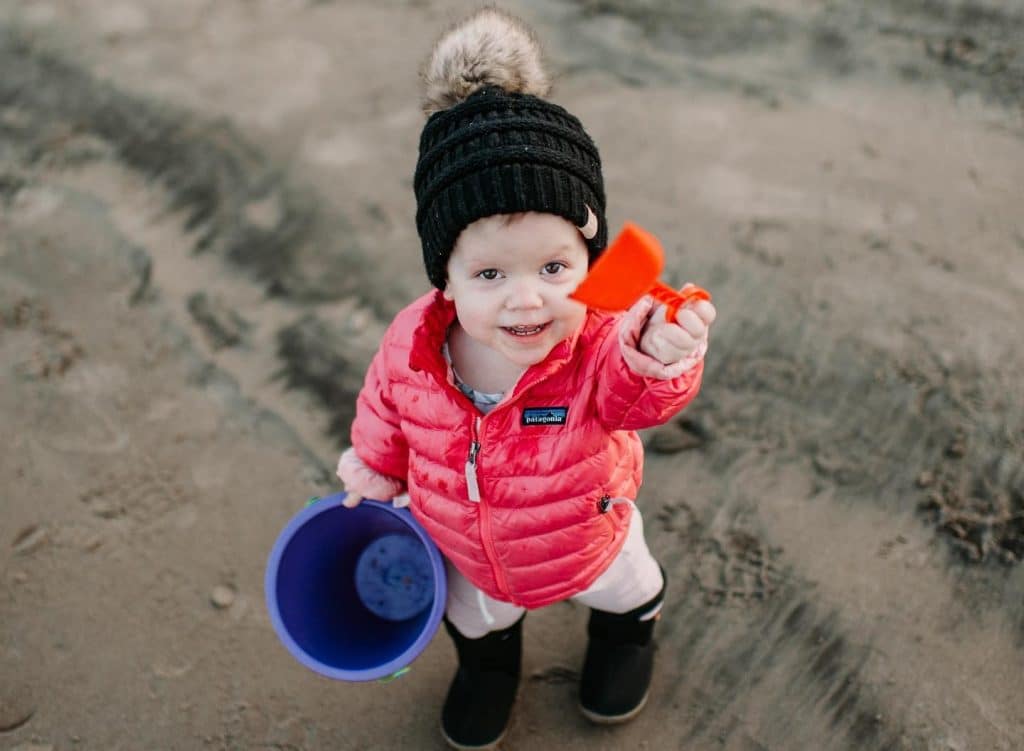 A litle girl in a red jacket