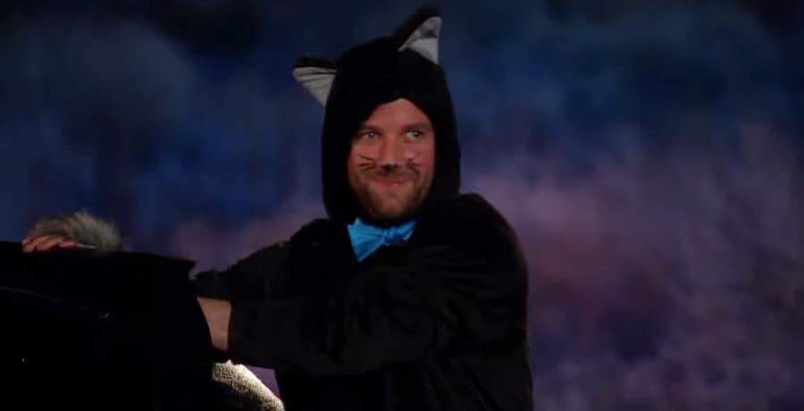 A man in a cat suit