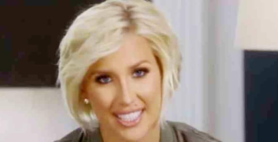 Savannah Chrisley Flashes Toned Midriff In Black Sports Bra [Credit: YouTube]