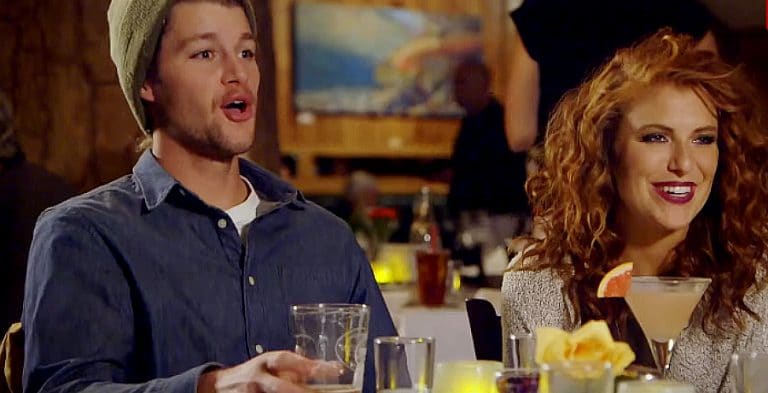 A man and a woman at a dinner table