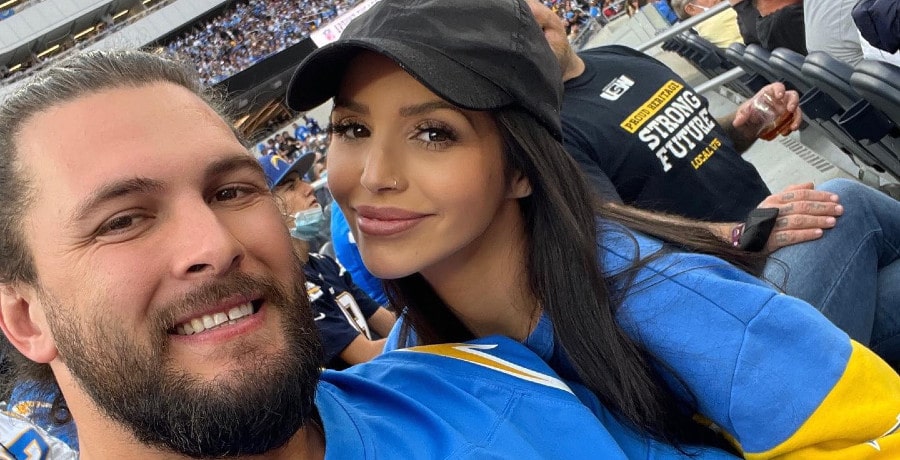 A man and a woman at a football game