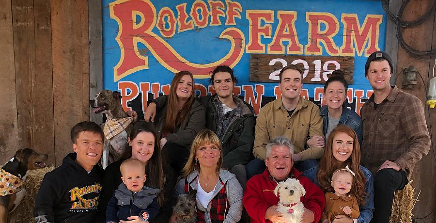 A group of people in front of a Roloff Farms sign