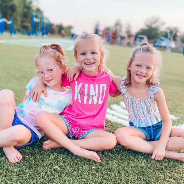 OutDaughtered stars Hazel, Riley & Parker Busby sitting in the grass. (Instagram)