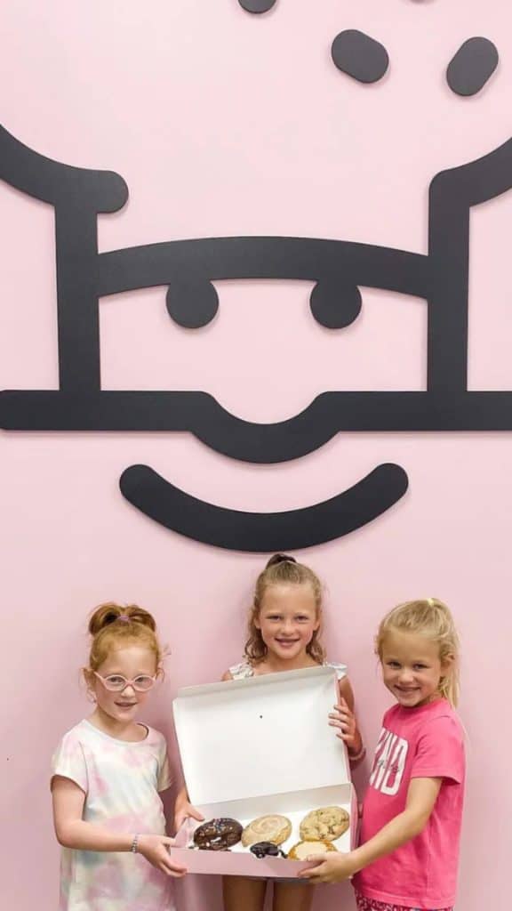 OutDaughtered stars Hazel, Riley & Parker Busby holding a box of cookies. (Instagram)