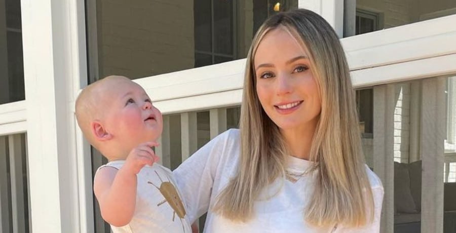Lauren Lane and son: A woman with blonde hair holding a one-year-old baby boy