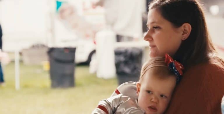 A woman holding her daughter