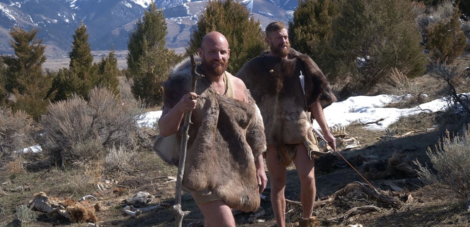 Waz and Jake walking smiling in Naked and Afraid XL: Frozen.