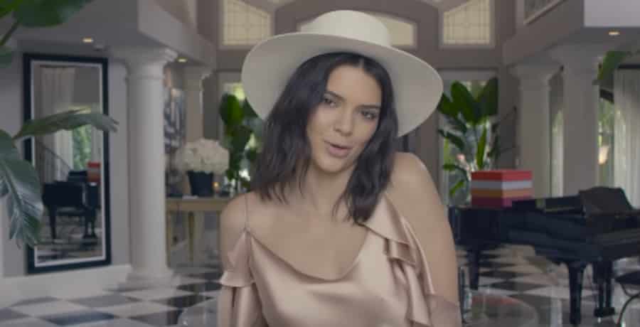 Kendall Jenner Sizzles In Barely-There Floral String Bikini [Vogue | YouTube]