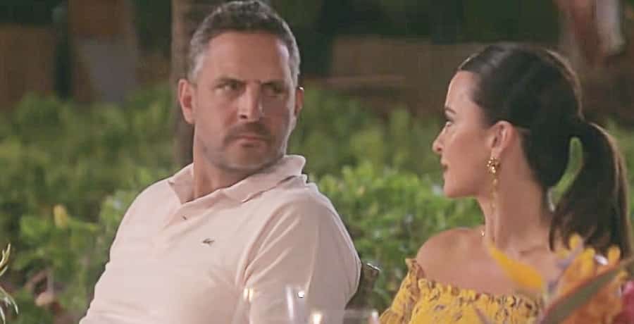 Kyle Richards - a woman with brown hair in a yellow dress, Mauricio Umansky - a man in a white shirt