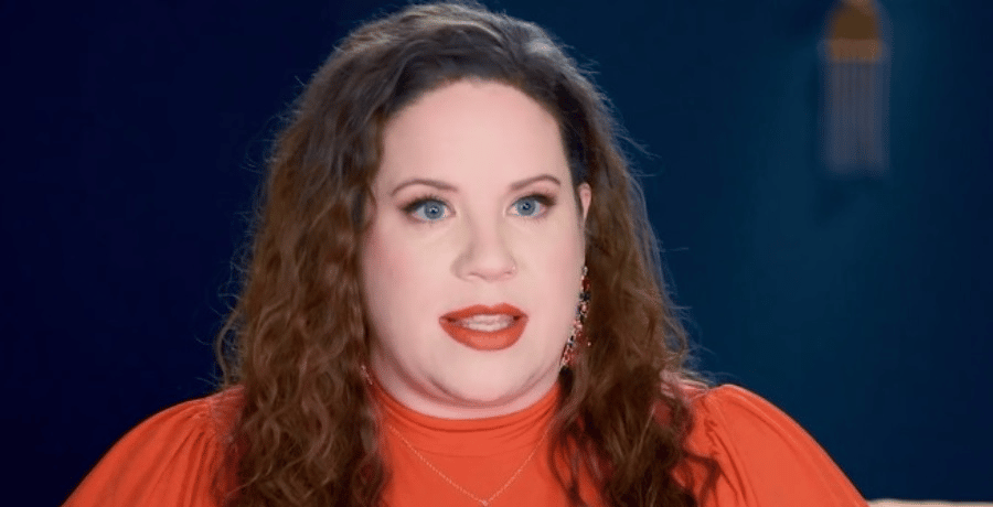 Whitney Way Thore - a woman with brown hair in a red shirt