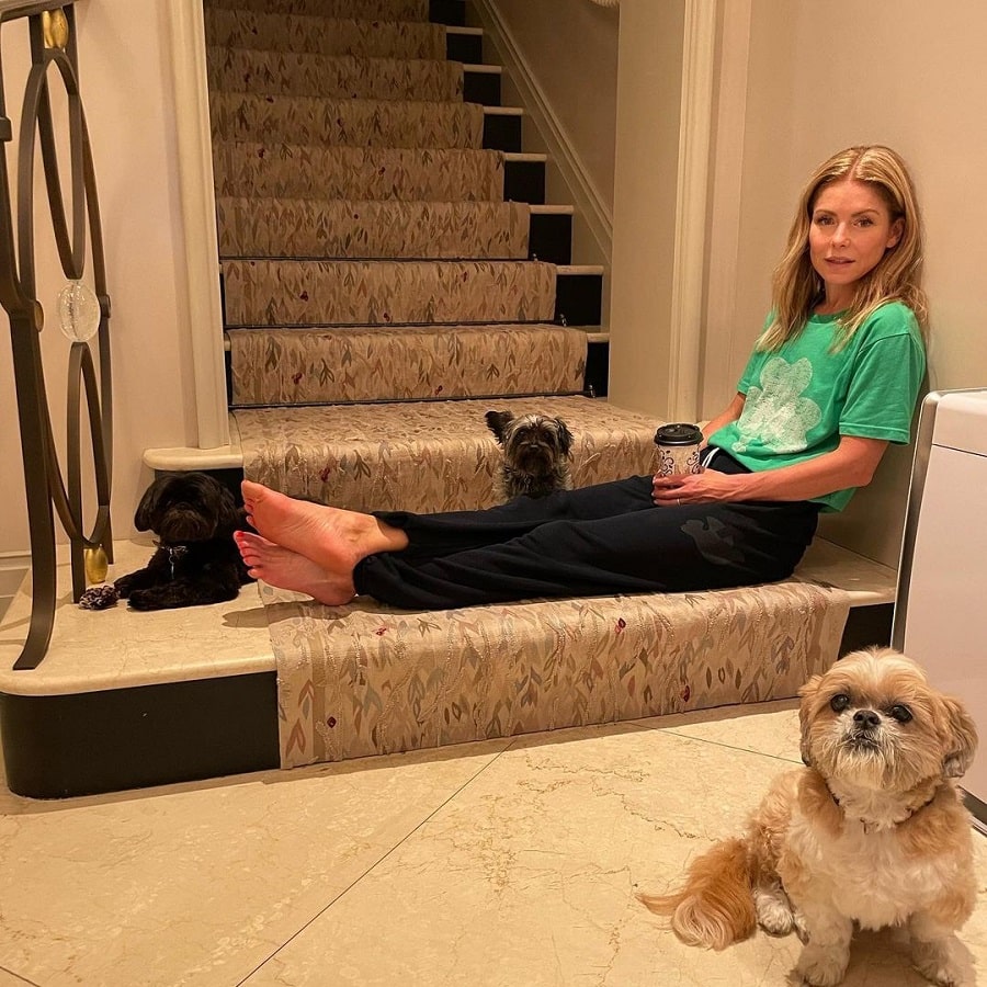 Kelly Ripa Sits At Bottom Of Stairs With Her Dog [Kelly Ripa | Instagram]