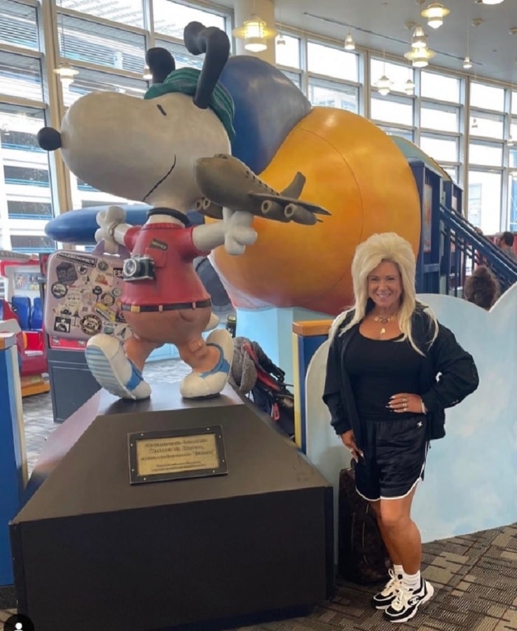 Theresa Caputo With Snoopy Statue [Theresa Caputo | Instagram]