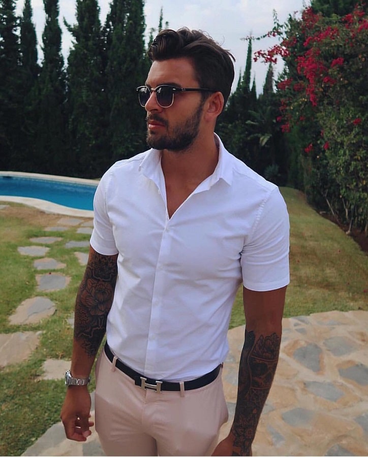 Adam Collard Wears White Button Up Shirt & Khakis [Adam Collard | Instagram]