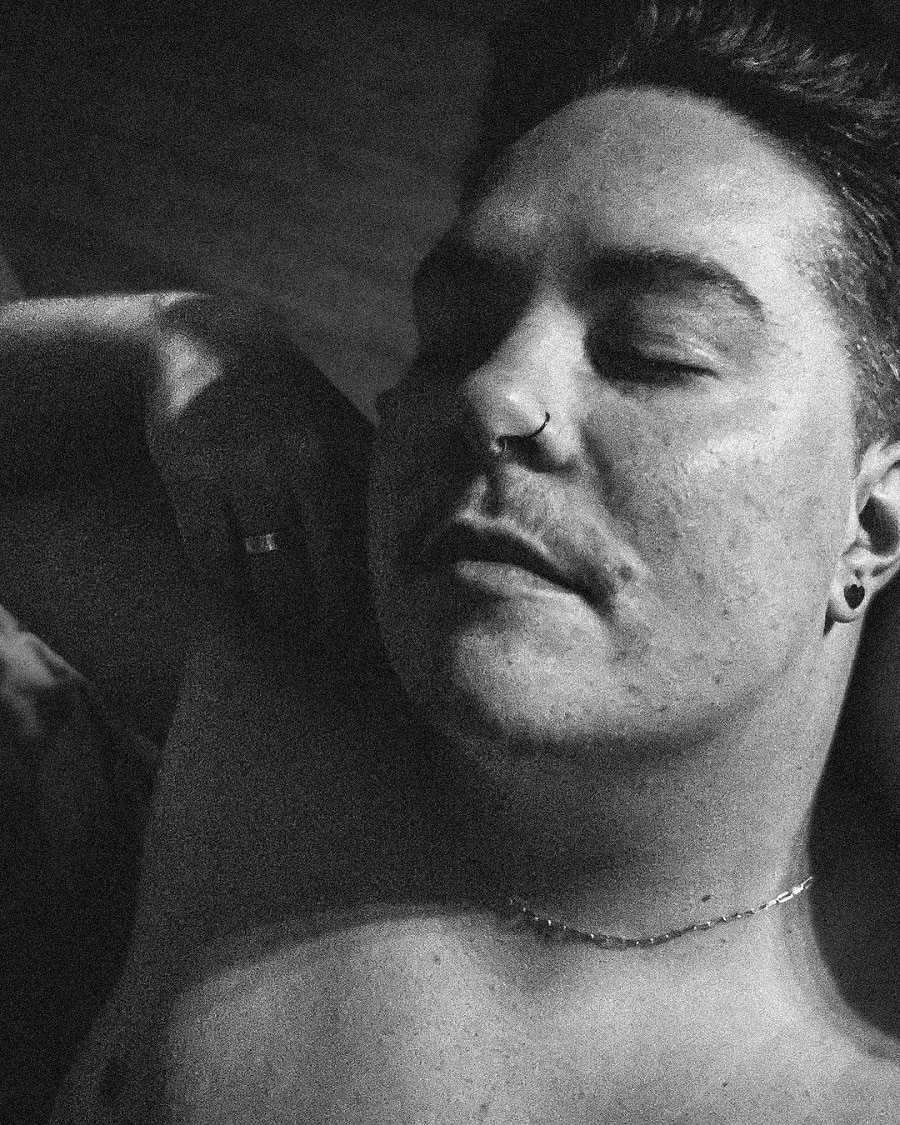 Audrey Kriss poses topless in black-and-white photo.