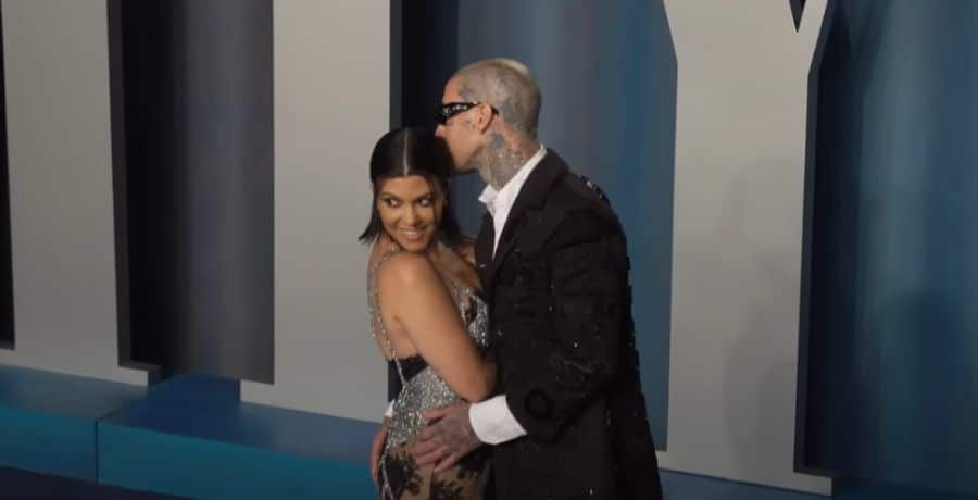 Kourtney and Travis Barker at a red carpet event - YouTube/Entertainment Tonight