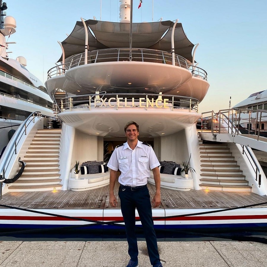 Reid Jenkins Poses In Front Of A Superyacht [Reid Jenkins | Instagram]
