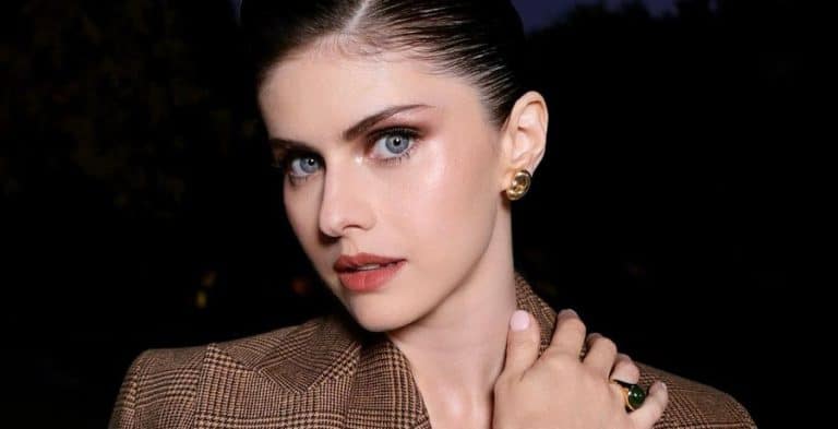 Close-up of Alexandra Daddario in Michael Kors blazer.