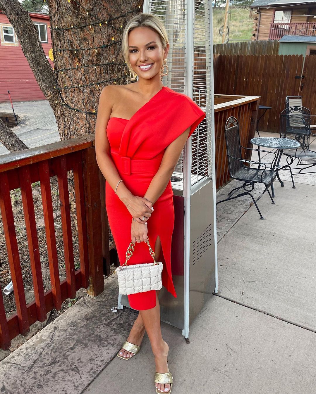 Emmy Medders in a red form-fitting dress.