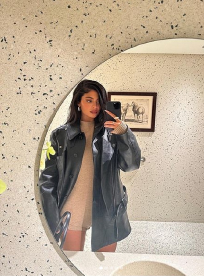 Kylie Jenner Wears Beige Dress Under Black Leather Coat [Kylie Jenner | Instagram]