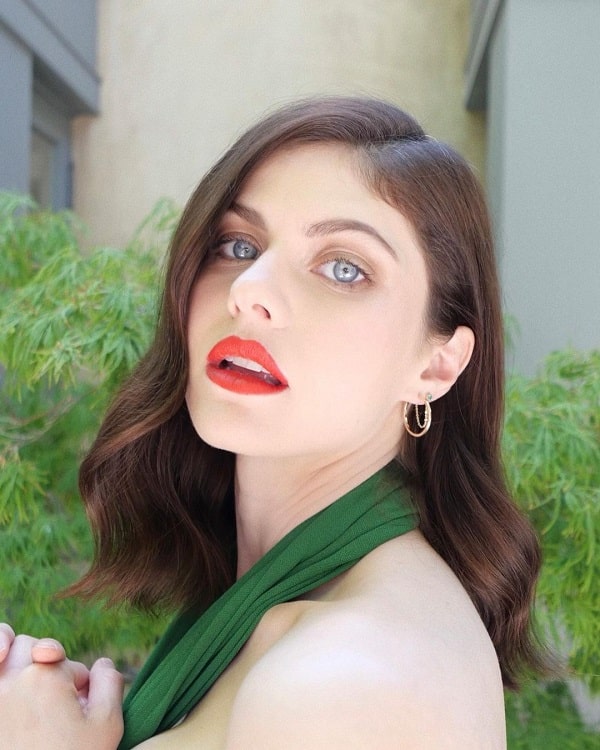 Close-up of Alexandra Daddario with red lipstick.