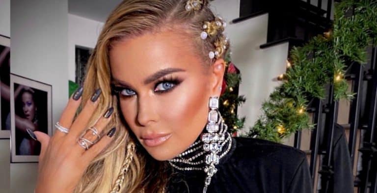 Carmen Electra Opens Wide & Spills Out Of Top
