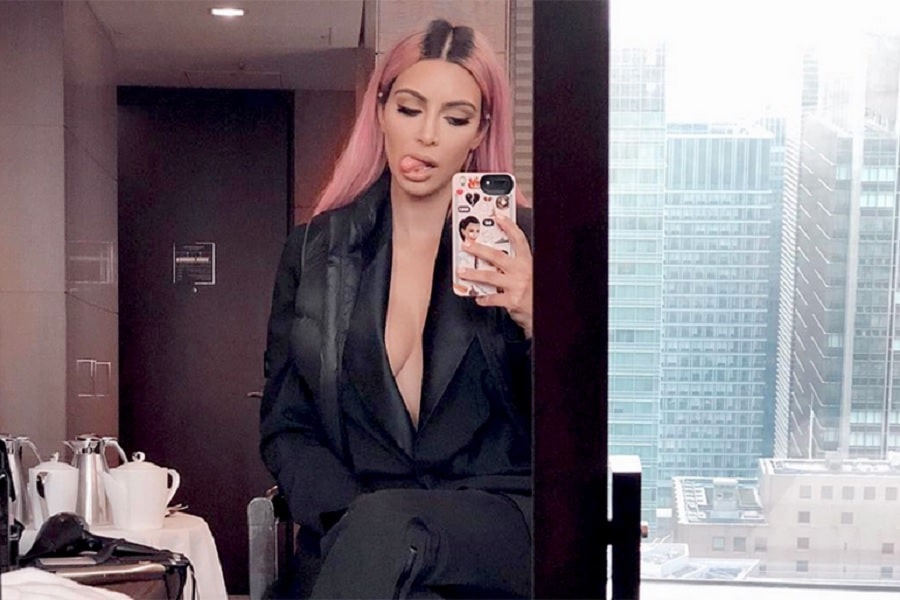 Kim Kardashian Sticks Out Tongue & Goes Braless Under Blazer [Kim Kardashian | Instagram]