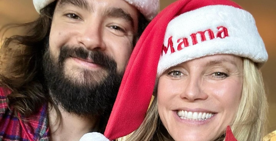 Heidi Klum and Tom Kaulitz wear Santa hats in close-up selfie.