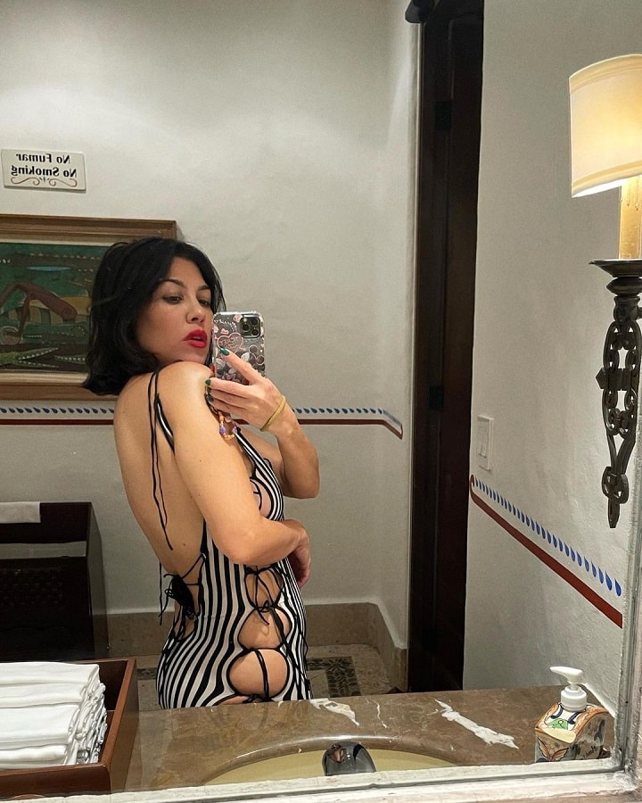 Kourtney Kardashian Poses In Stripe One-Piece [Kourtney Kardashian | Instagram]