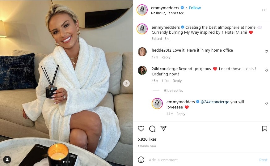 Emmy Medders Crosses Legs In White Robe [Source: Emmy Medders - Instagram]