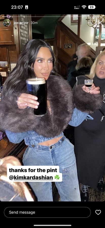 Kim Kardashian Drinks Beer In Fur-Trimmed Jacket [Source: Joe Pryor - Instagram Stories]