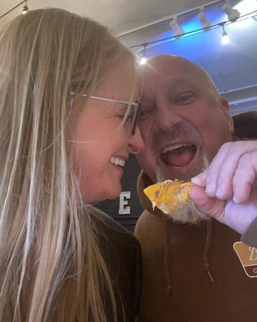 Christine and David Woolley eating nachos [Source: David's Instagram]