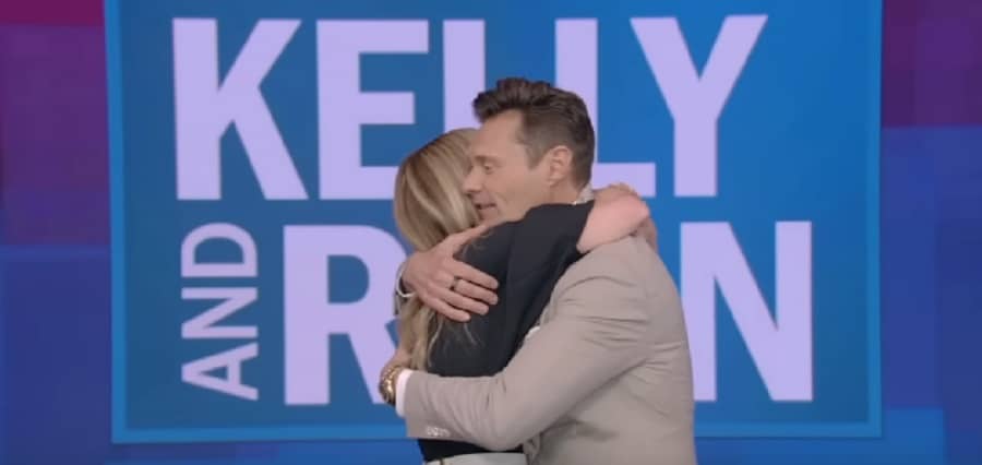 Kelly Ripa & Ryan Seacrest Hug [Source: YouTube]