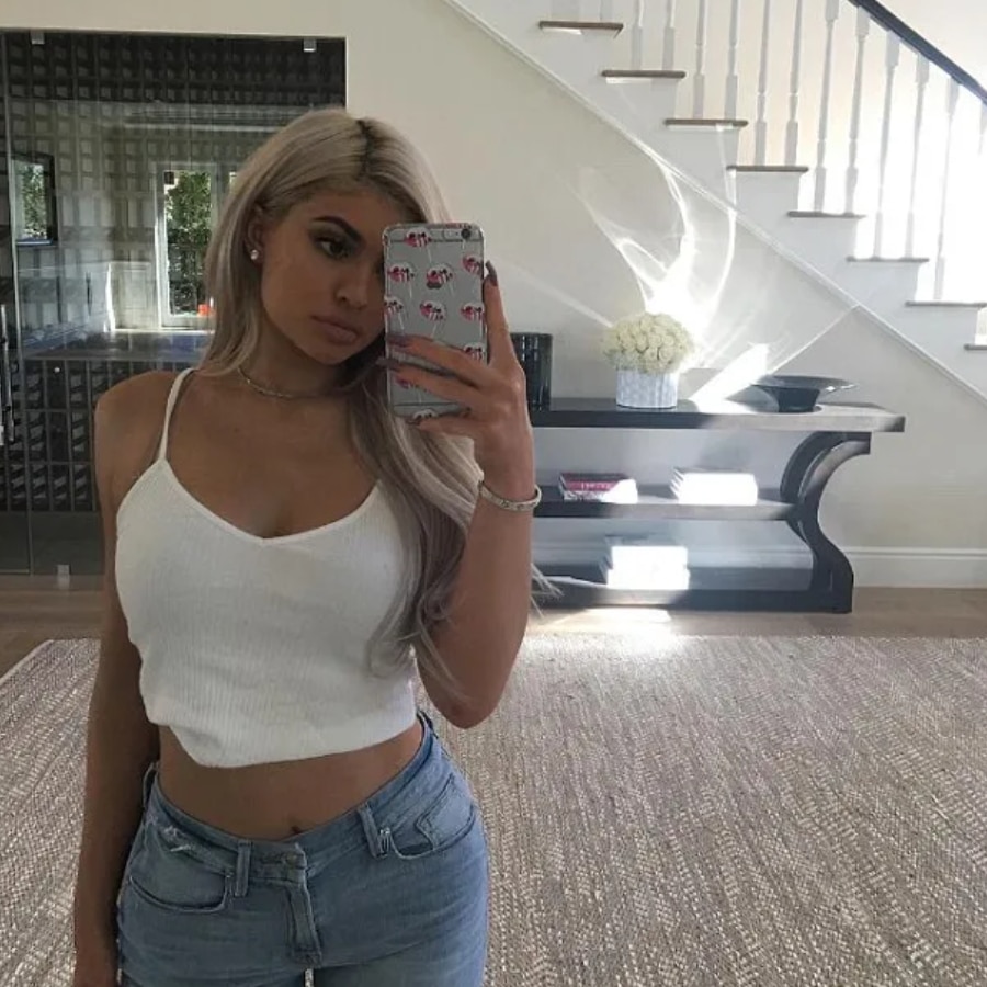 Kylie Jenner Flaunts Cleavage & Midriff In White Tank [Source: Kylie Jenner - Instagram]