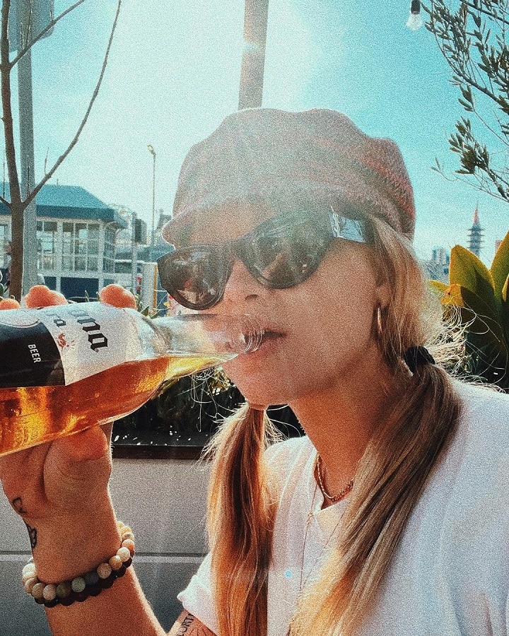 Mads Herrera Wears Newsboy Cap & Drinks Beer [Source: Mads Herrera - Instagram]