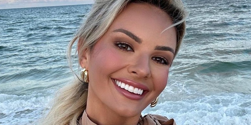 Emmy Medders smiling at the beach [Instagram]