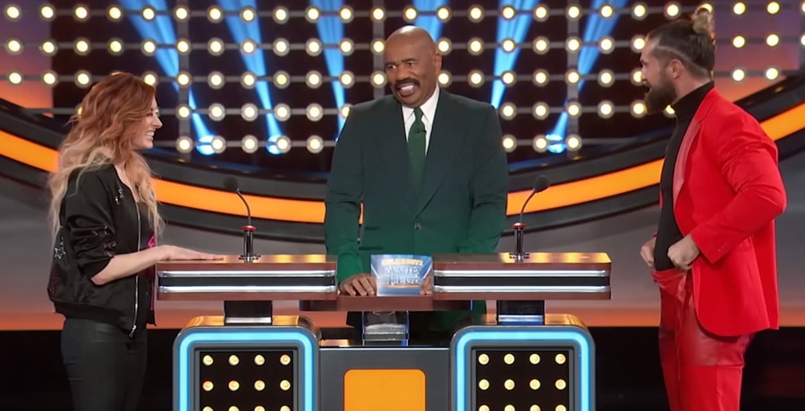 Steve Harvey with the WWE stars on Family Feud / YouTube