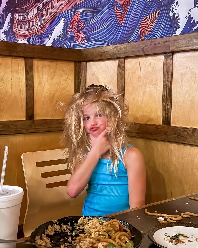 Busby Quints with wild hair - Instagram