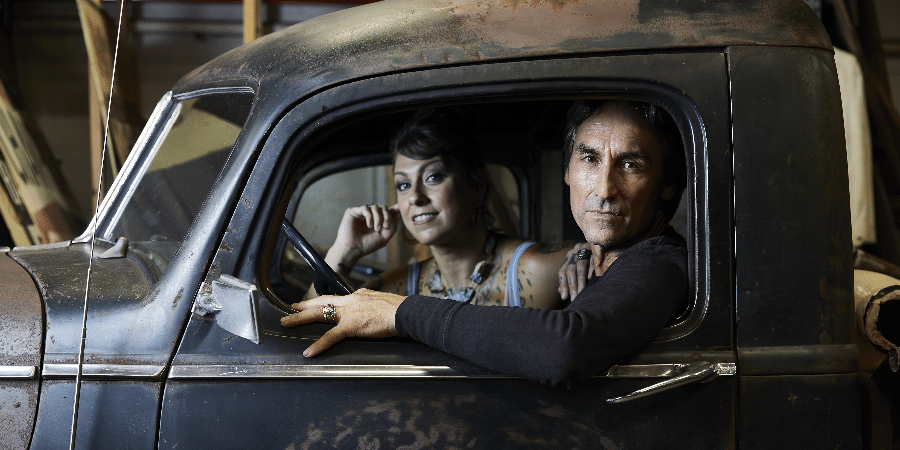History channel. Mike Wolfe and Danielle Colby-Cushman sit in a classic truck for publicity photo.