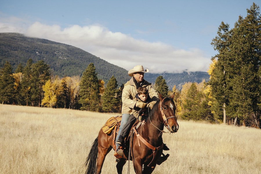 Yellowstone Pictured (L-R): Kevin Costner as John Dutton and Brecken Merrill as Tate Dutton. Photo: Emerson Miller for Paramount