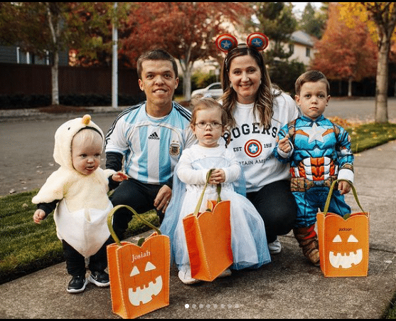 Zach, Tori, Jackson, Lilah and Josiah Roloff pose for family picture while out trick-or-treating.