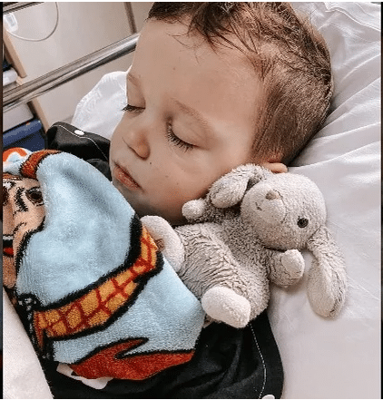 Jackson Roloff in hospital bed following leg surgery in November 2021.
