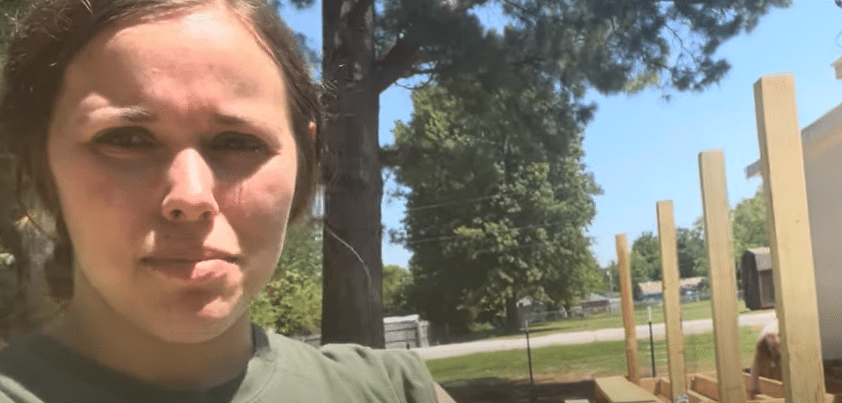 Jessa Duggar Seewald standing in front of her DIY back deck.