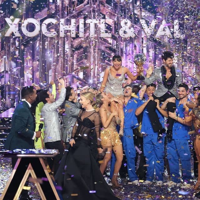DWTS Season 32 contestants lift Xochitl Gomez and Val Chmerkovskiy in the air, from Dancing With The Stars Instagram account