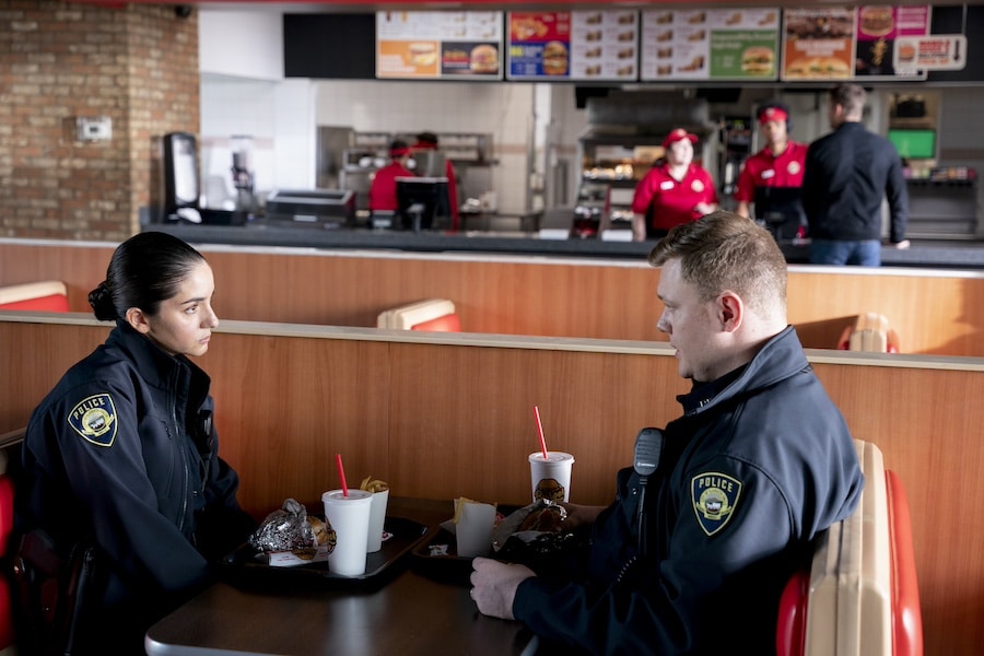 Tracker Pictured: Paniz Zade as Officer Amini and Nemo Cartwright as Cop. Photo: Michael Courtney/CBS ©2022 CBS Broadcasting, Inc. All Rights Reserved.