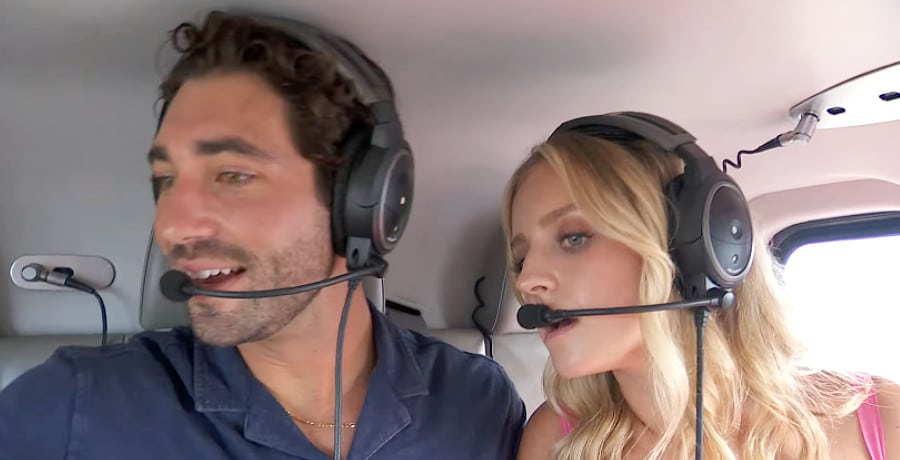 A woman and a man in a helicopter