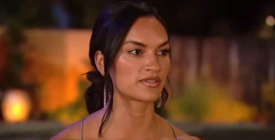 A photo of a woman with her hair in a ponytail