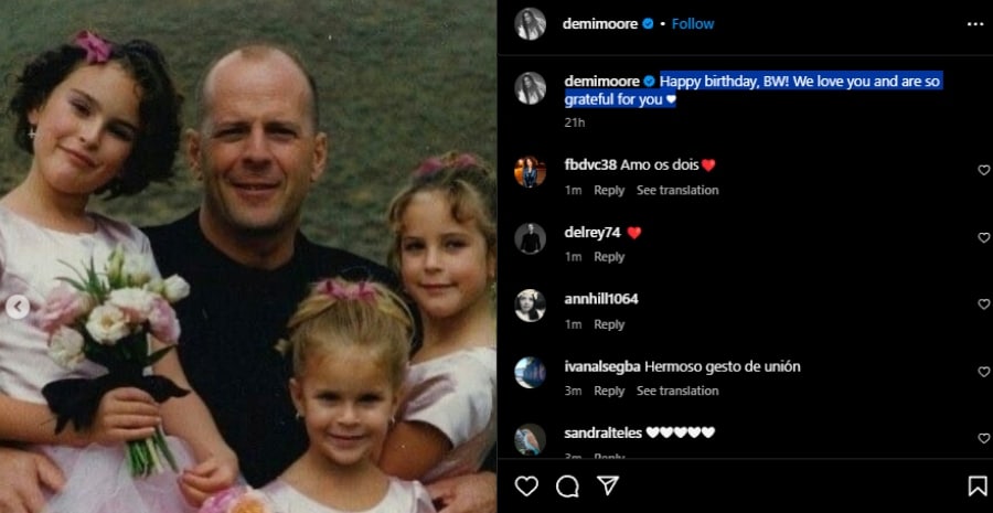 Bruce Willis holding his daughters. - Instagram