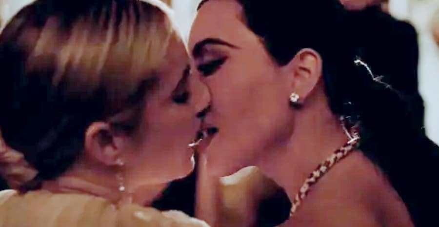Emma Roberts and Kim Kardashian share a seductive kiss. - American Horror Story
