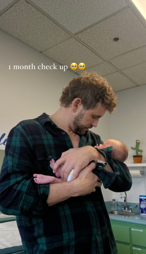 A man holding his newborn baby